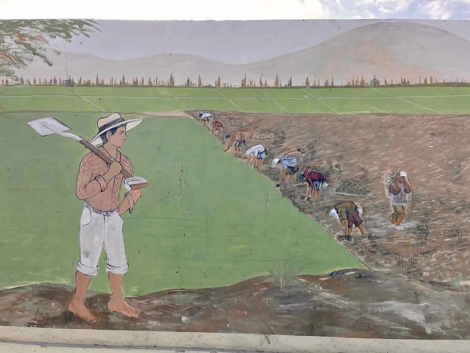Mural of community tending to rice saplings