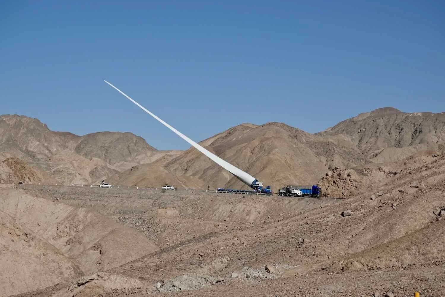 The mountain road was so winding and narrow, this wind turbine blade had to be tipped up to make it around the curves.