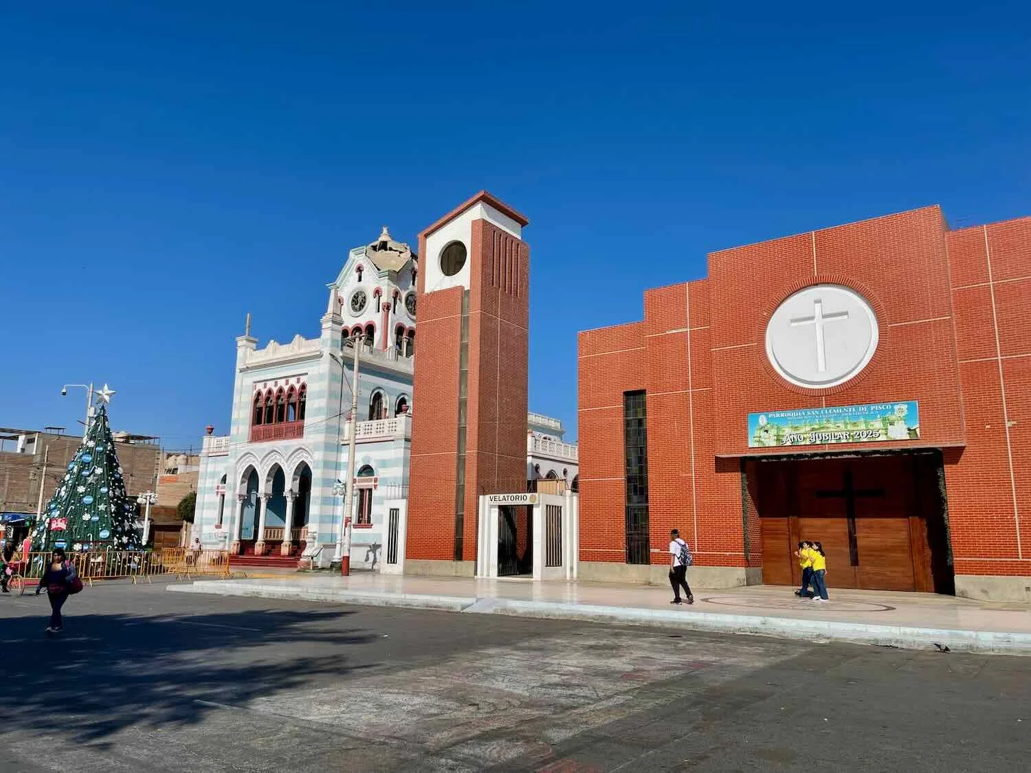 The earthquake-damaged, moorish-style municipal building (left) contrasted sharply with the rebuilt, modernist Church of San Clemente (right)