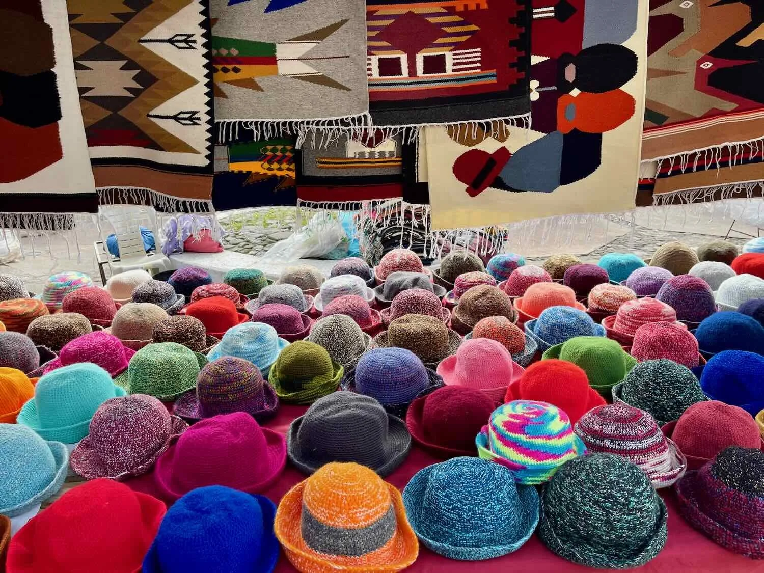 Traditional knitted hats and woven blankets