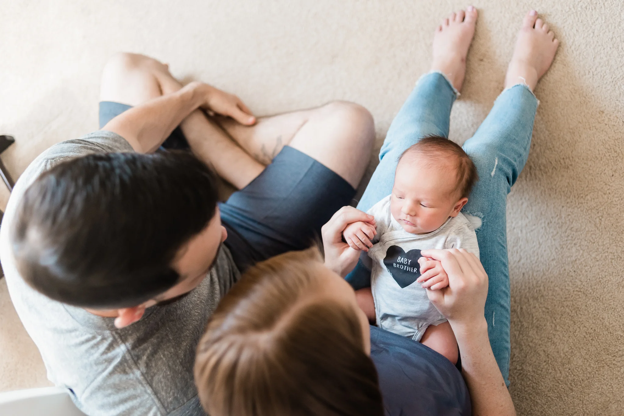 Mother and father holding baby boy, newborn lifestyle photography, portland oregon, hillsboro oregon, in home newborn session, baby boy, portland newborn photographer