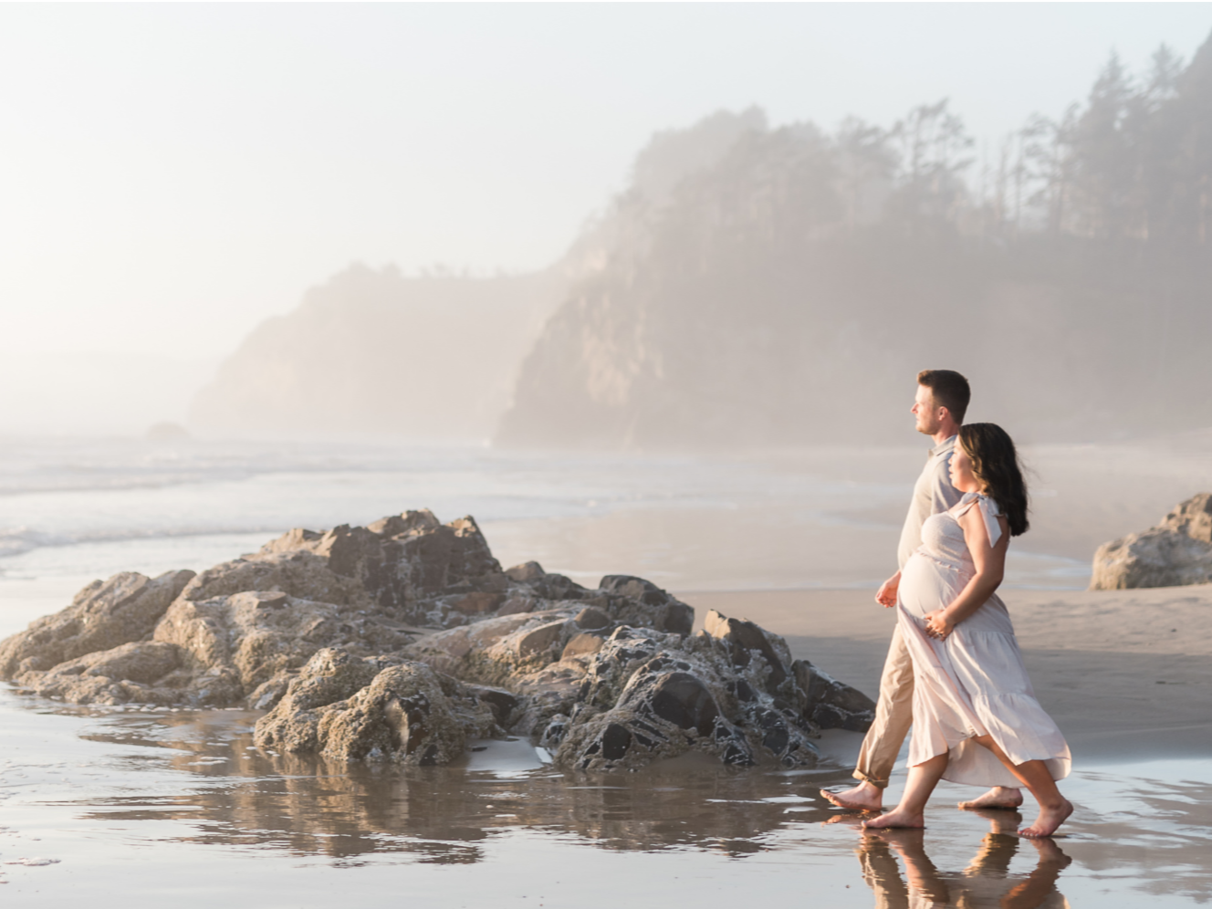 Couple walking on beach at the Oregon Coast