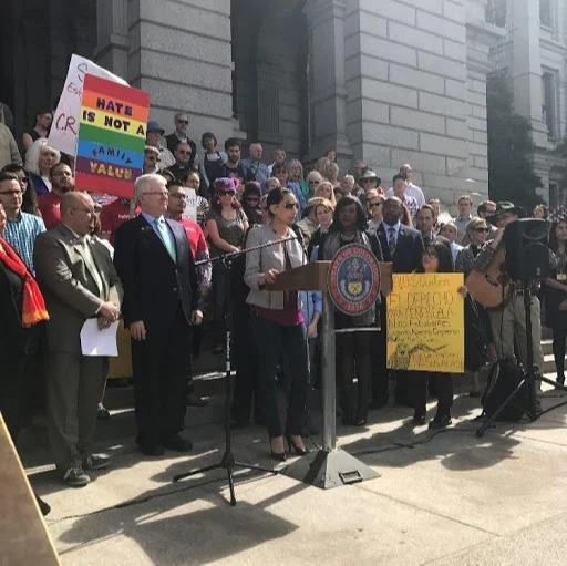 Photo of Iman Jodeh speaking at the Federal Government Overreach Rally on the West Steps of the Capitol.