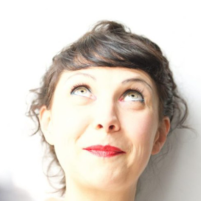 A photo of Caroline Horton smiling.