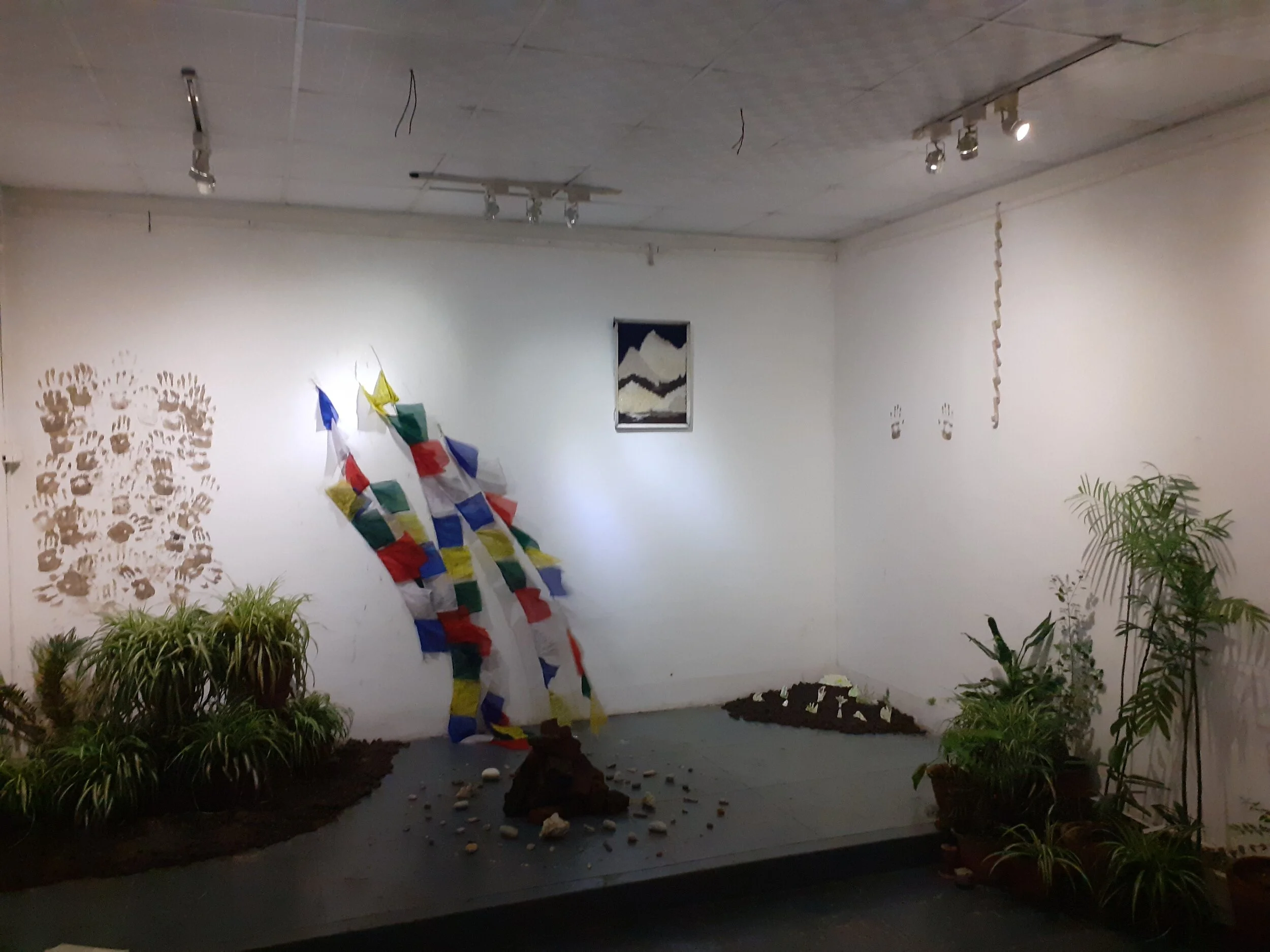 flowers for an unforgotten lover, Bikalpa Art Center, Kathmandu During my six week residency at Bikalpa Art Center, I became largely interested in communicating my appreciation for the Nepali environment and landscapes unique to the country. Centered around a “sacred mountain” made of broken bricks from the 2015 Nepal earthquake, surrounded by a collection of rocks collected along the Ganga (Ganges River) in Haridwar. I tried to create an installation that lead people “through the forest and over the mountain, back into the forest”. Using a fan (hidden behind the plants), I wanted to create an installation that blew around in the “wind”, and emulate the idea of standing on top of the mountain (Sagarmatha/Mount Everest), surrounded by plants unique to Nepal. The audience were invited to participate in the installation by following a simple set of instructions: 1. Take a moment to appreciate the sensation of breath, and breathe. 2. Collect a pomegranate seed from the bowl, and reflect on a relationship that has ended. This can be in any capacity, whether it be someone who has died, a friend that is no longer in your life, or a lover. Any relationship felt that in some way unresolved, essentially. 3. Offer gratitude for the relationship, then plant the seed and bury the memory. 4. Collect an incense stick, light it, burn it, and let go. This participatory installation proved to be a highly emotionally rewarding experience, as several people responded positively to their part of the work. One of the participants became highly emotional after their turn, and I found out afterwards she was mourning the loss of her father through this work. This to me was an incredibly moving reaction, as typically I am not empathetic at all, but I truly felt her sensation in that moment. It was without question the most profound experience I have had so far in my artistic career. I had explained to her afterwards all the seeds were to be scattered around the premises after the exhibition ended, so for the rest of her life she was more than welcome to return and sit by her father’s trees. This installation was without question a very special experience for me, as it allowed me to fully comprehend and analyze my thoughts on death. In truth, we are here forever. Once we die, the energies of our existence carry on in the lives of those we influenced, and we have a full time telephone line direct to that energy, because they all live inside us, and will continue to do so until the day we die, and this cycle repeats.