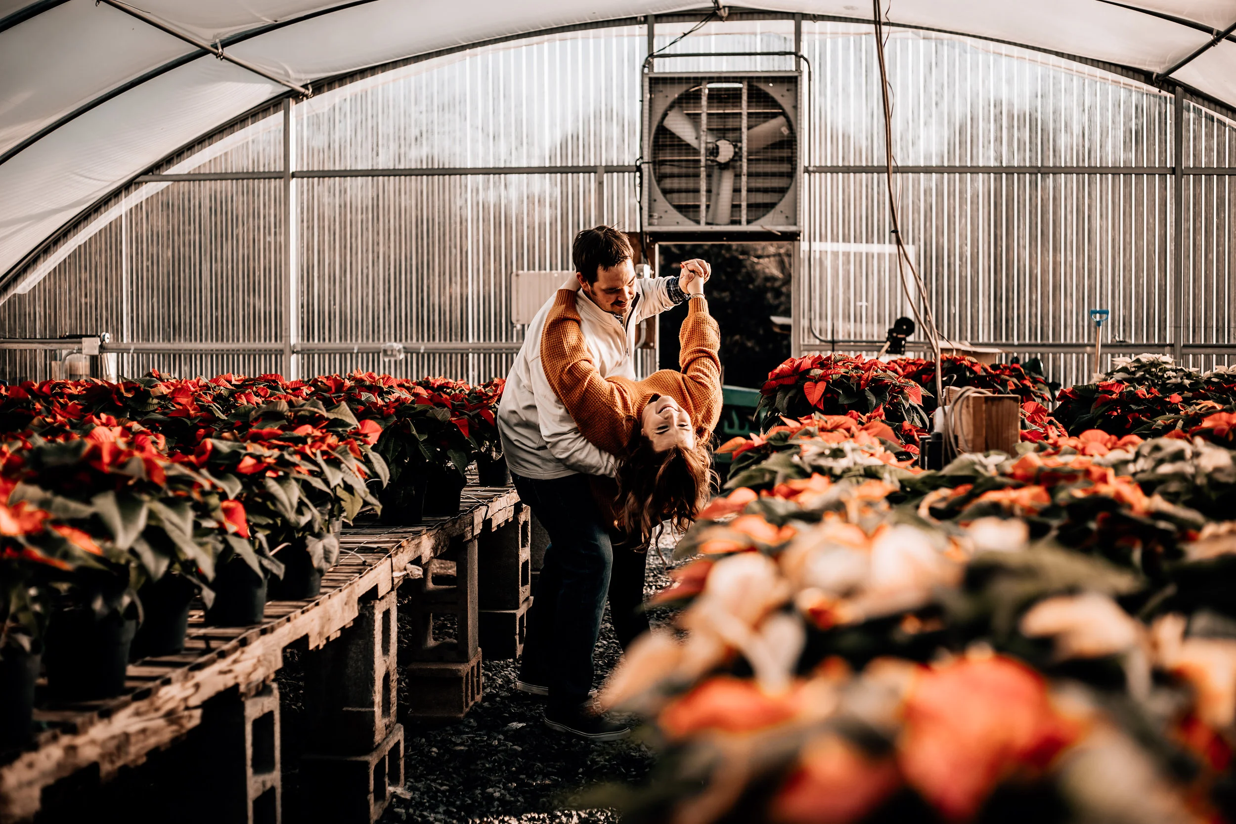 For these two’s Christmas photos, we headed over to a greenhouse full of Poinsettias & it was such a unique and fun location, I loved doing these! Also, this couple totally rocked it in front of the camera! I barely even had to tell them what to do - they were so comfortable and it was just such a fun and relaxed time!
