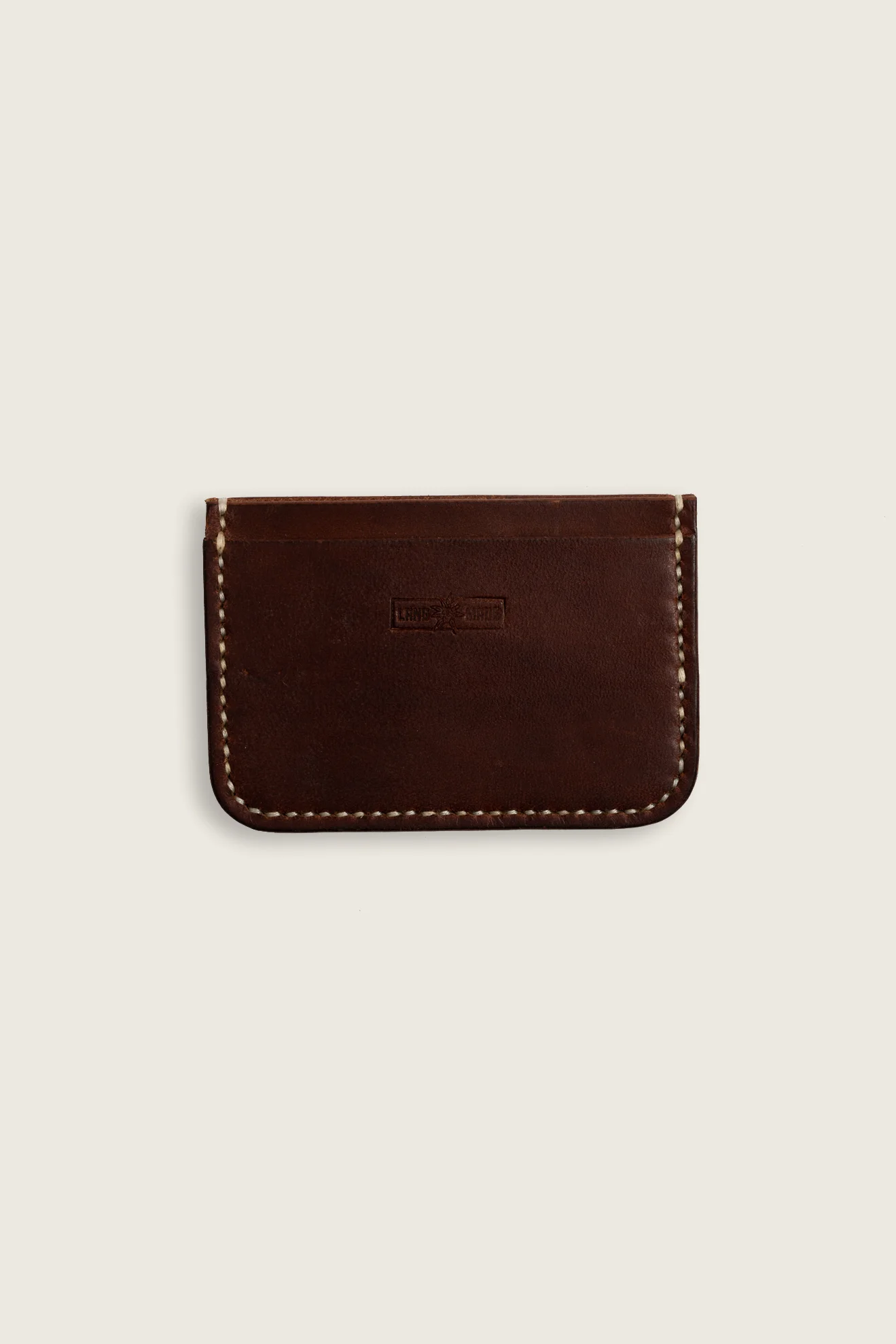 Hand stitched minimalist card holder in vegetable tanned leather mahogany back