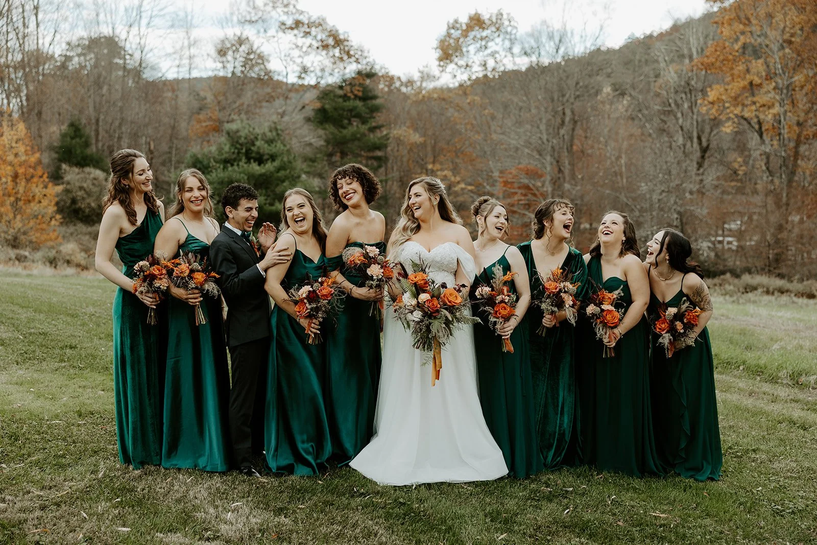 A bridal party laughing for photos