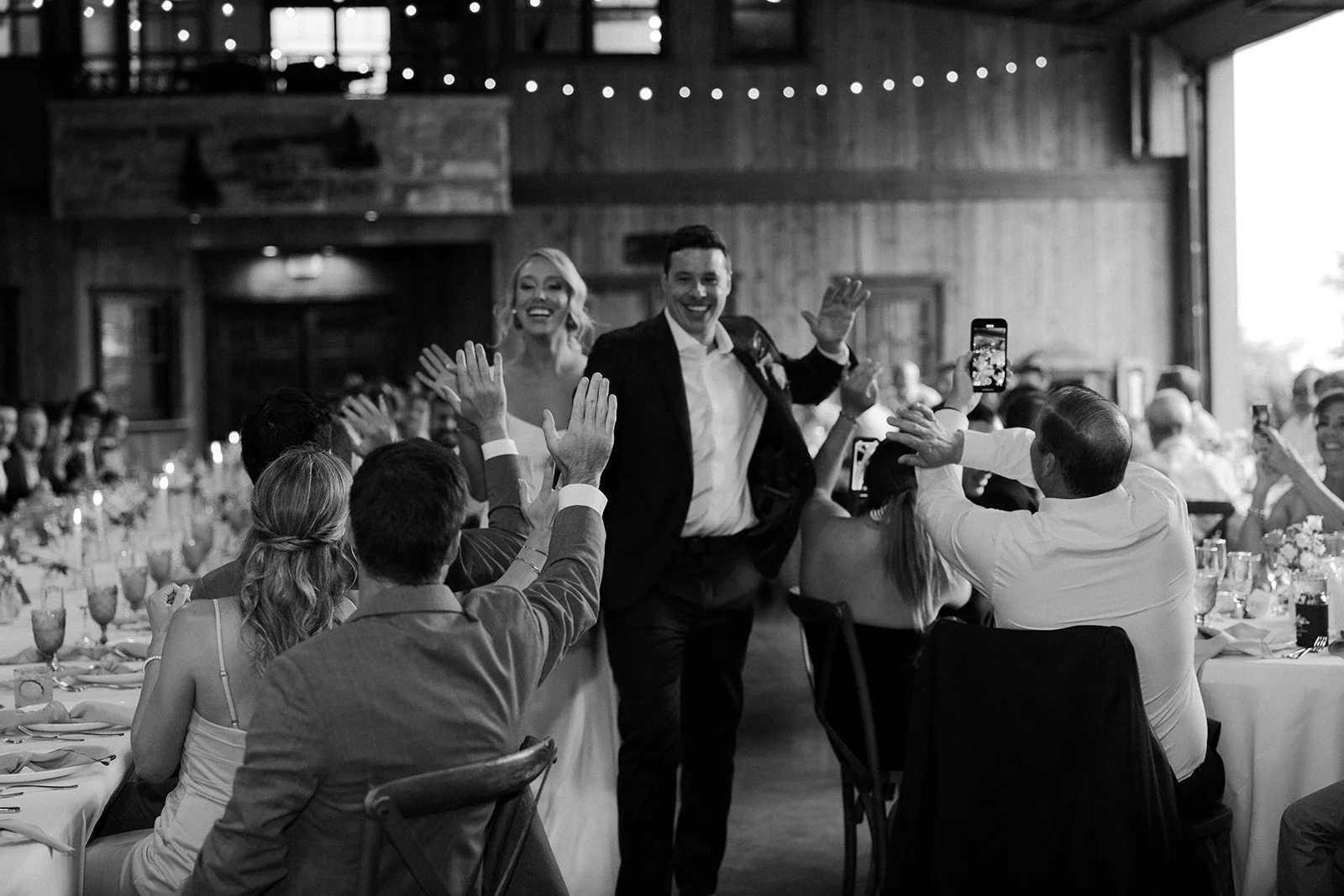 A bride and groom entering the wedding reception at their destination wedding