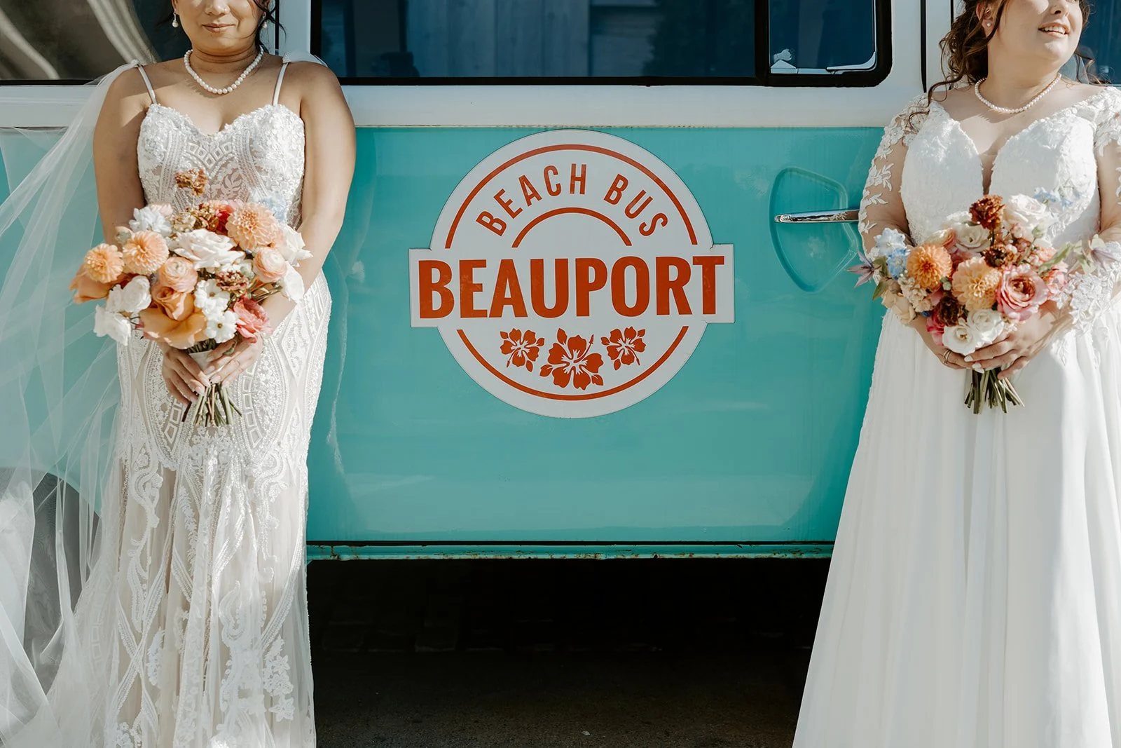 Two brides posing with the bus at Beauport Hotel