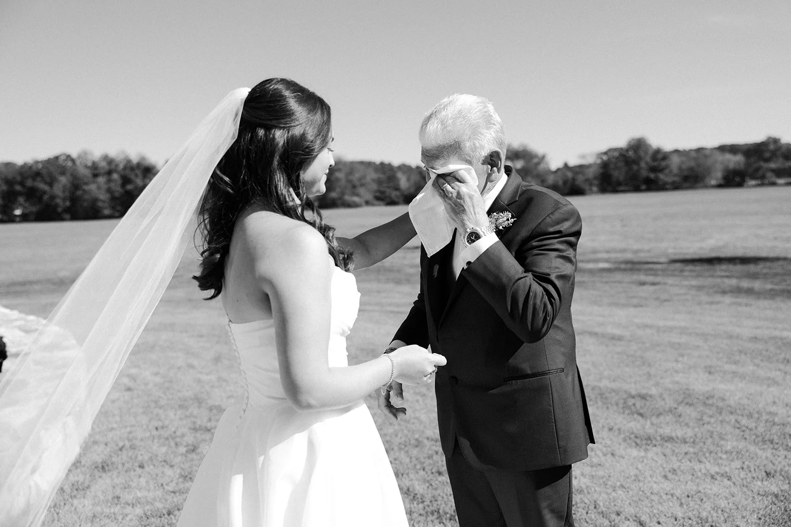 A bride's father crying during a first look