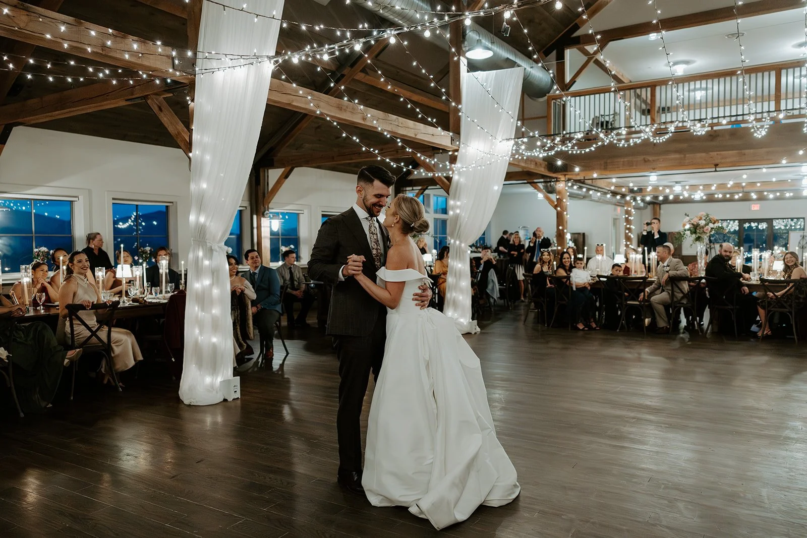 A bride and groom during their first dance inside of Mountain Top REsort