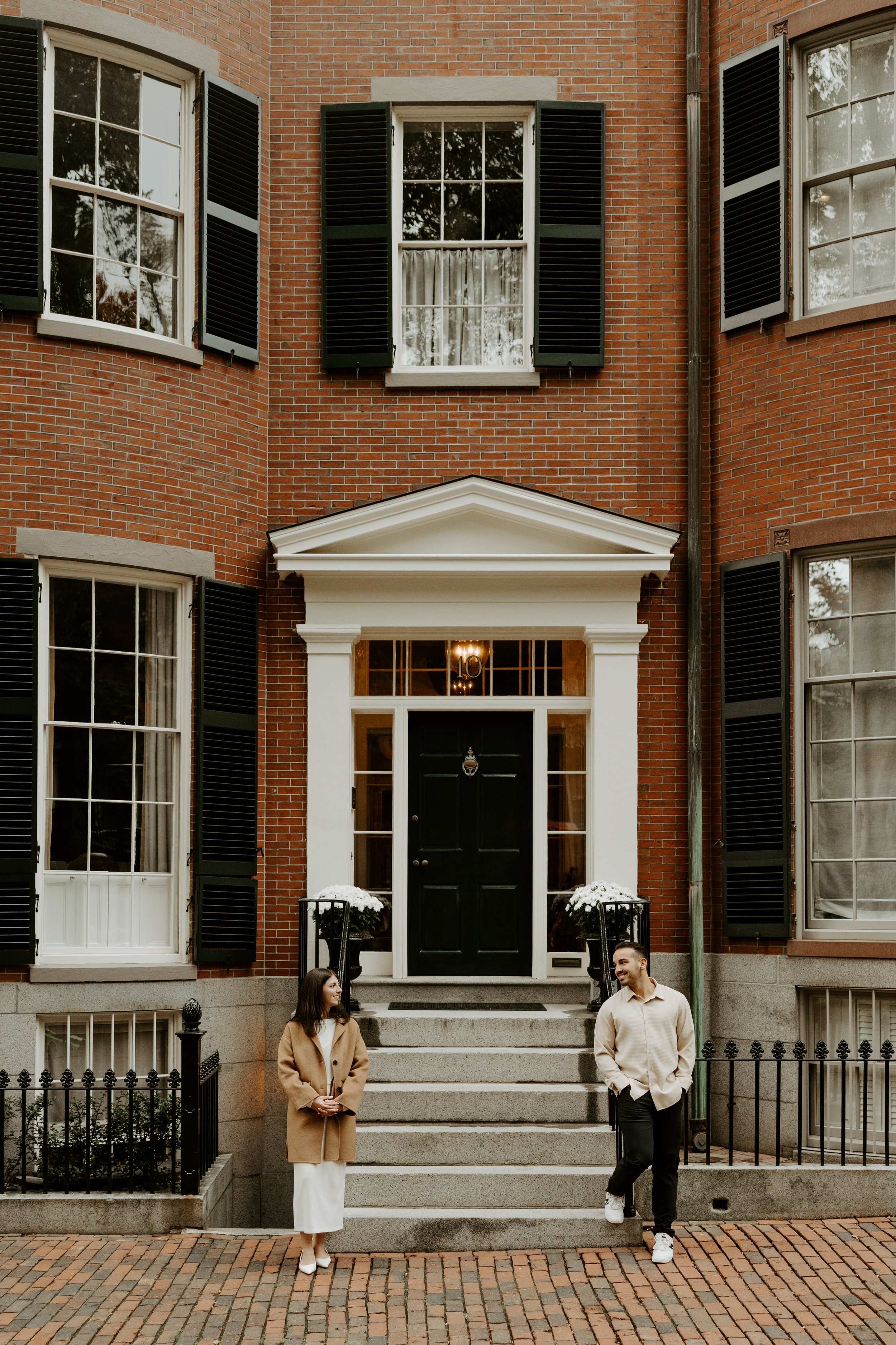 A couple posing for their engagement photoshoot in Beacon Hill
