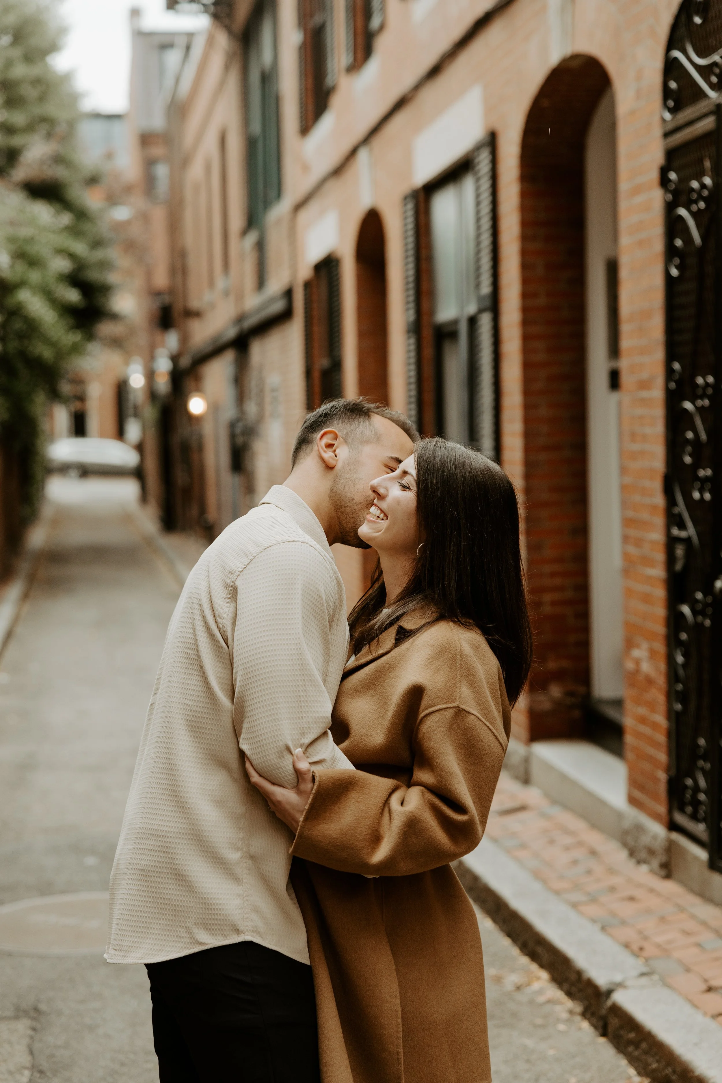 A couple posing for their engagement photoshoot in Beacon Hill