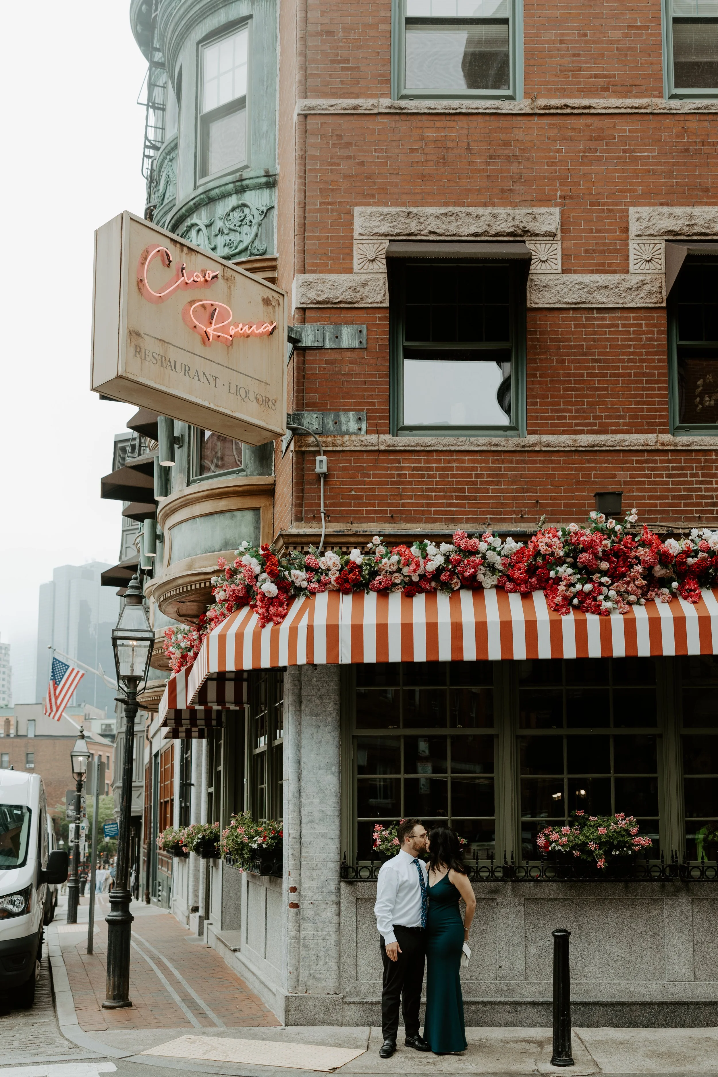 A couple posing in North End Boston, captured by a Boston engagement photographer