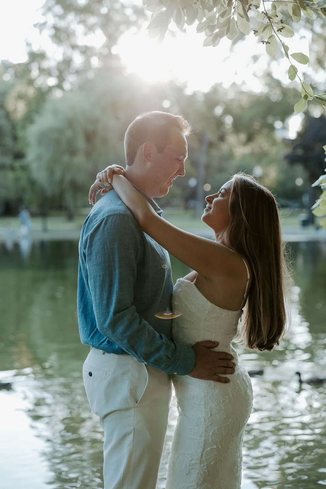 A couple posed by a Boston engagement photographer in Public Garden