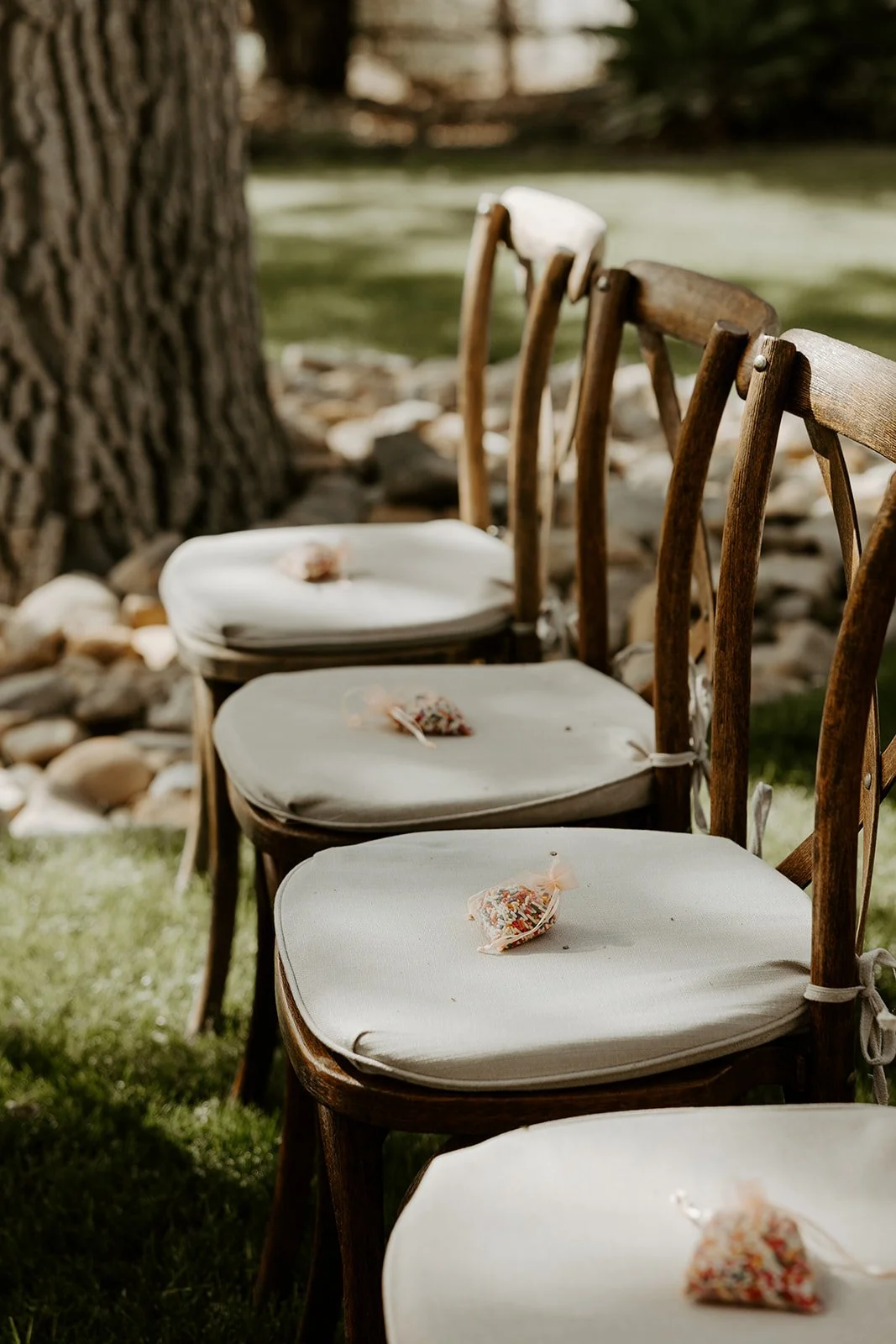 RAinbow sprinkles on the chairs for guests for an LGBTQ+ wedding