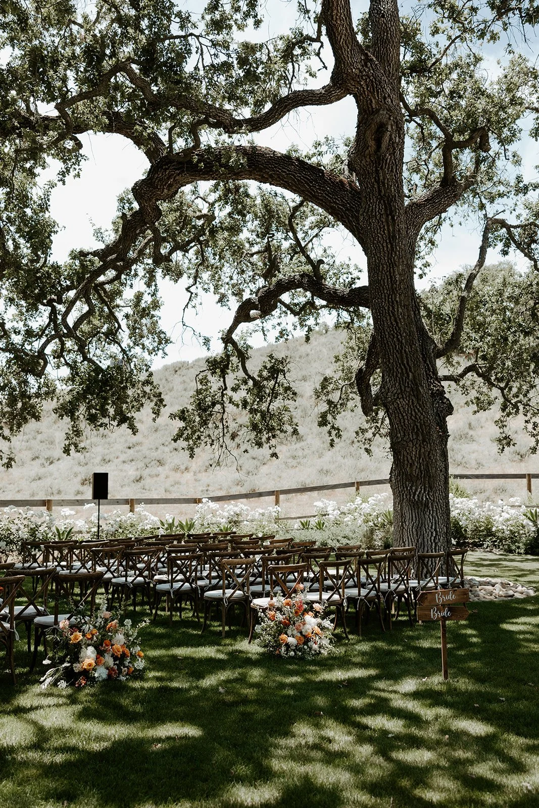 A wedding ceremony setup from a whimsical wedding outdoors