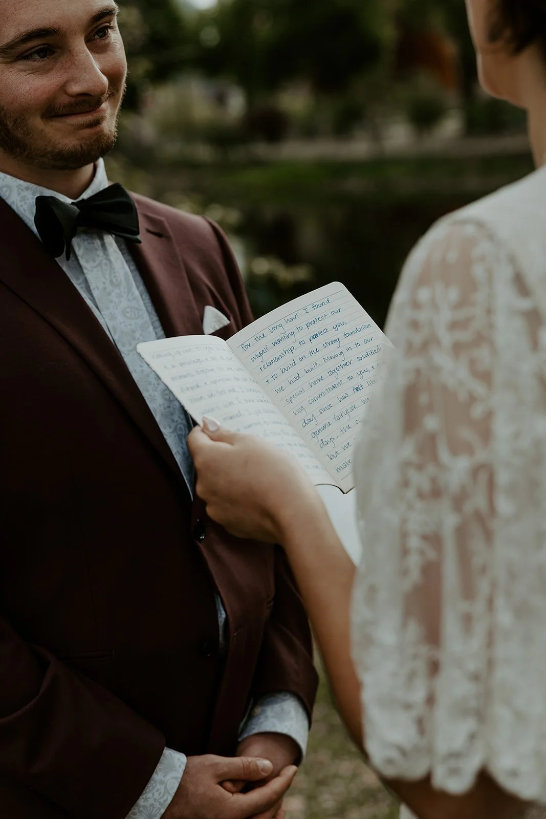 A woman reading vows during a Boston elopement