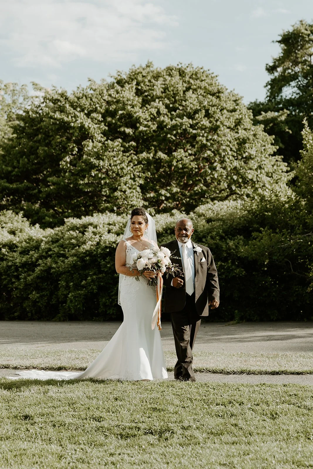 A bride walking down the aisle with her father