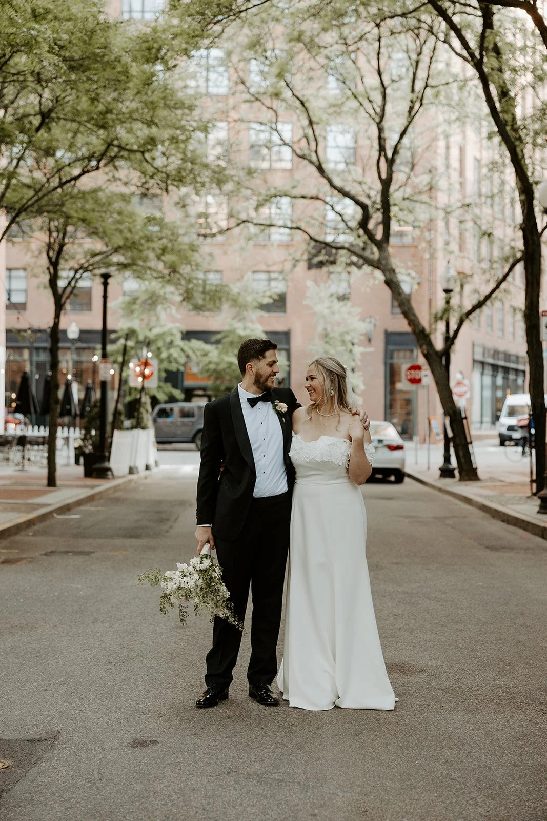 a couple stopping for photos on their way to their elopement location