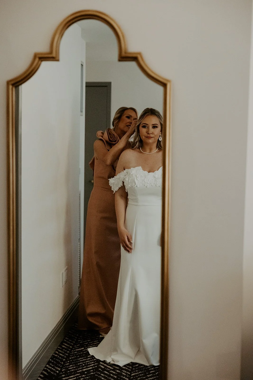 A bride's mother helping her get ready for her Boston elopement