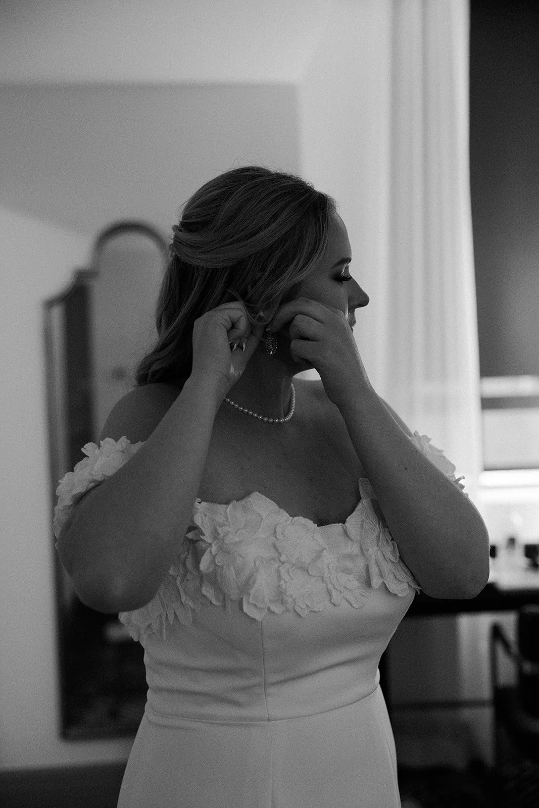 A bride getting ready before heading to her elopement location
