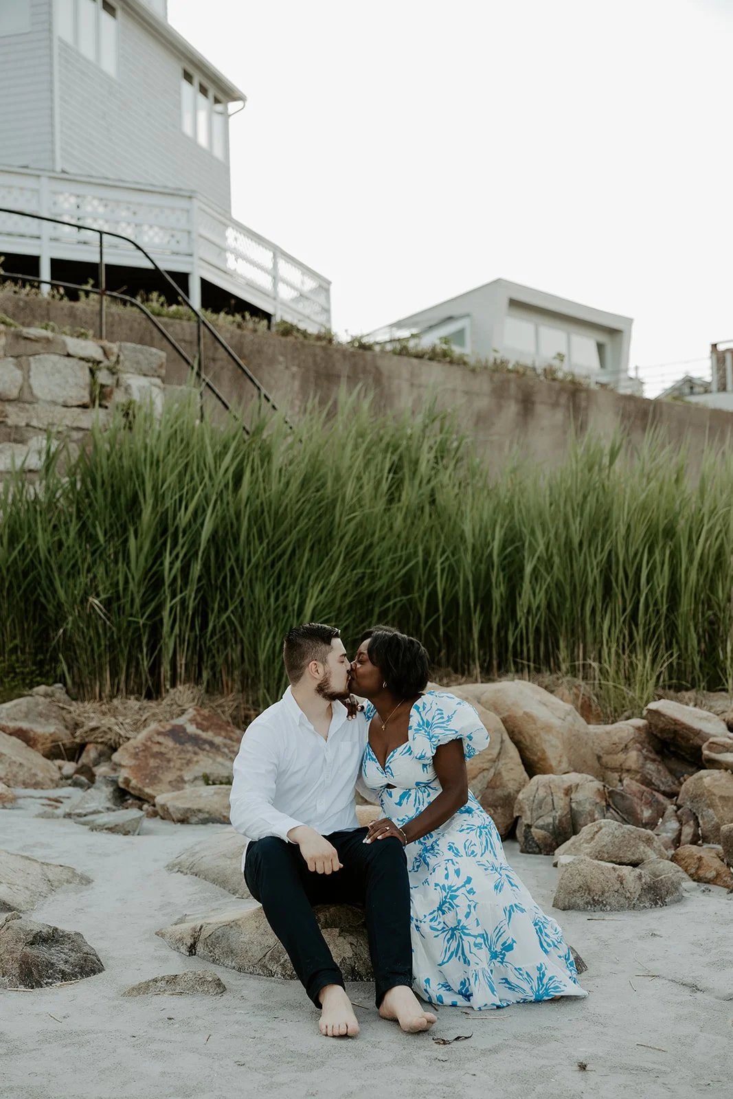 A couple kissing during beach engagement photos