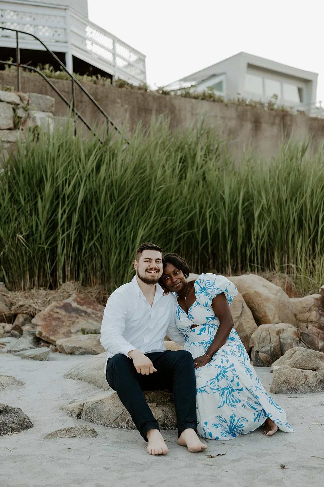 A couple sitting on the rocks on Wingaersheek beach