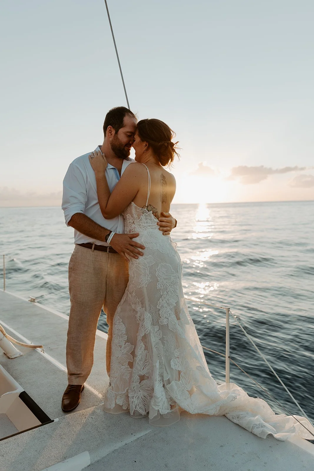 A couple on a sunset cruise in their destination wedding location, St. Lucia