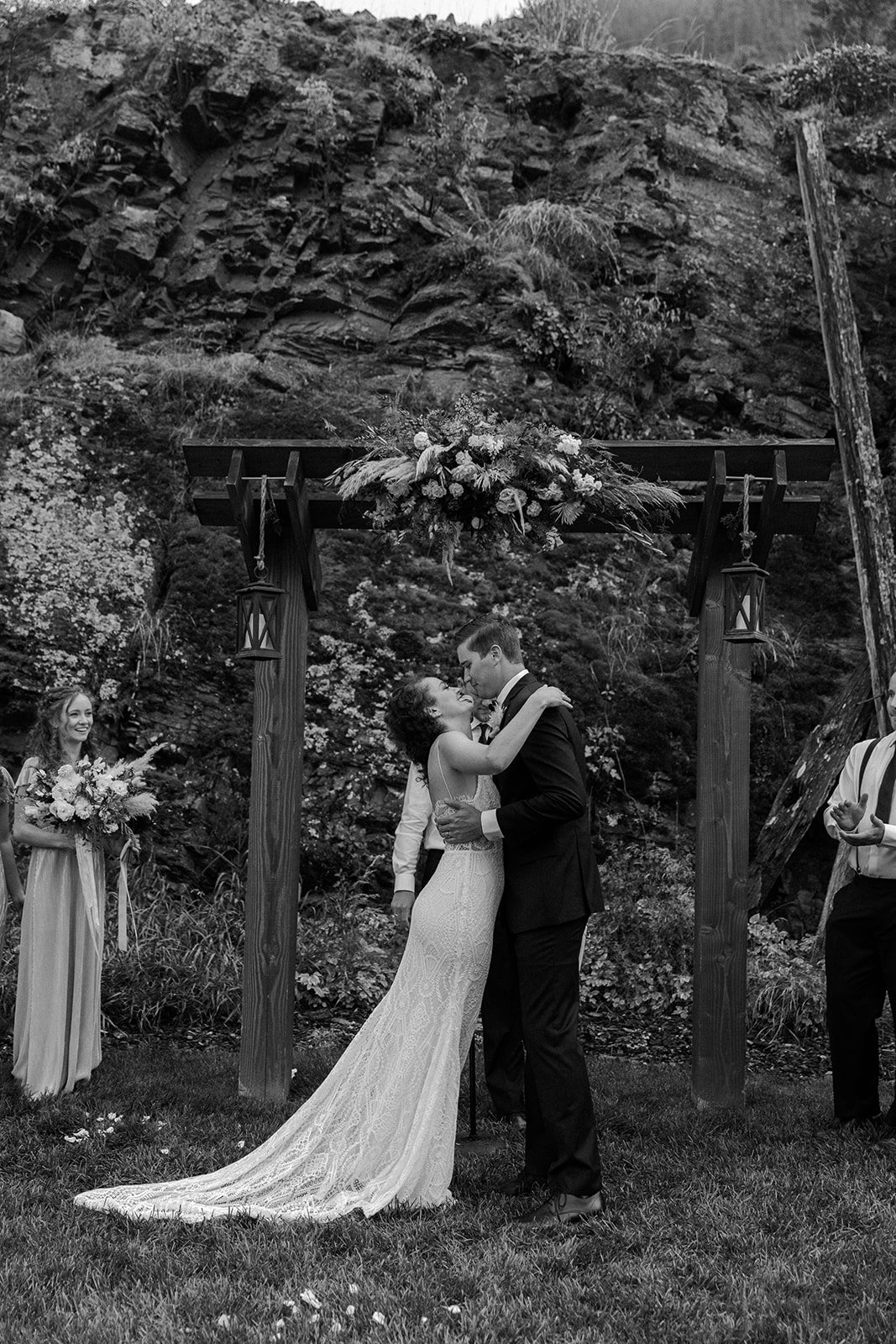 A bride and groom kissing during their destination wedding ceremony