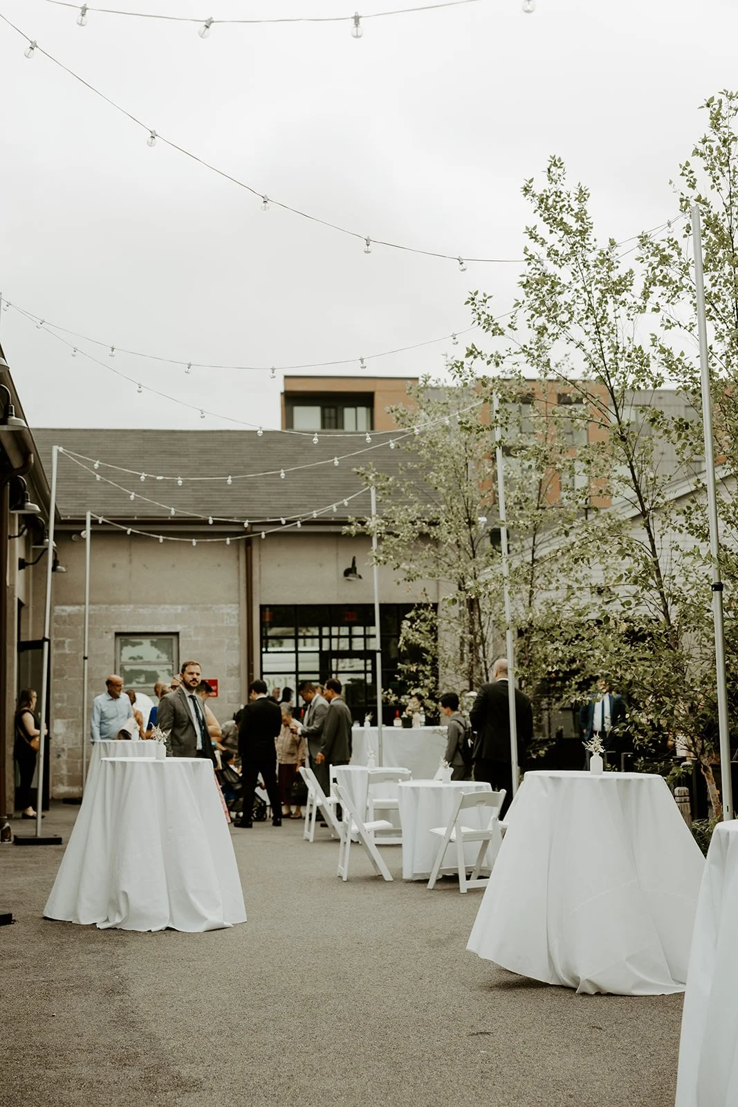 An outdoor patio at Garage B set up for a cocktail hour