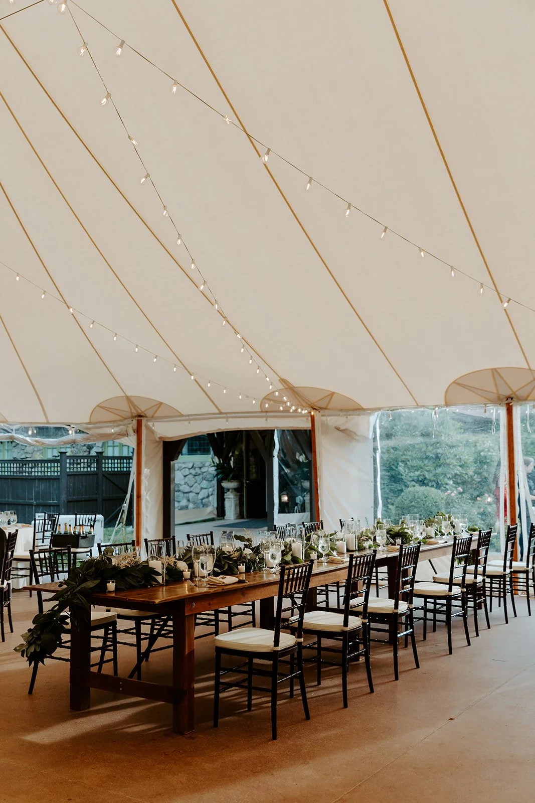 A wedding reception underneath a tent