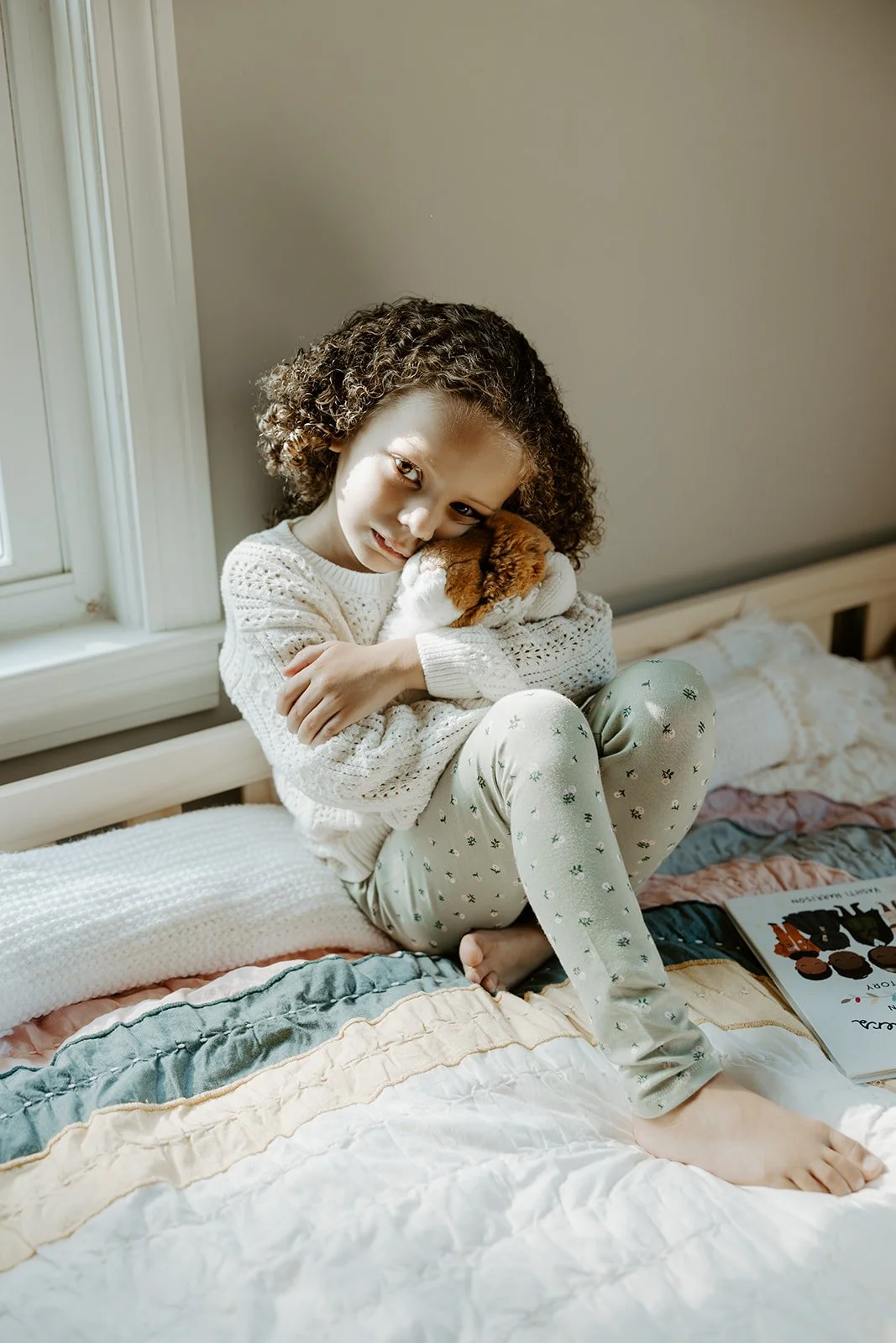 A little girl in her bedroom for family photos at home