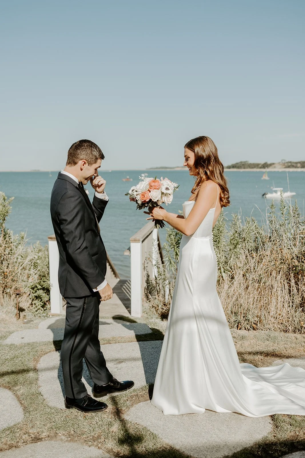 A man crying during a first look with his bride