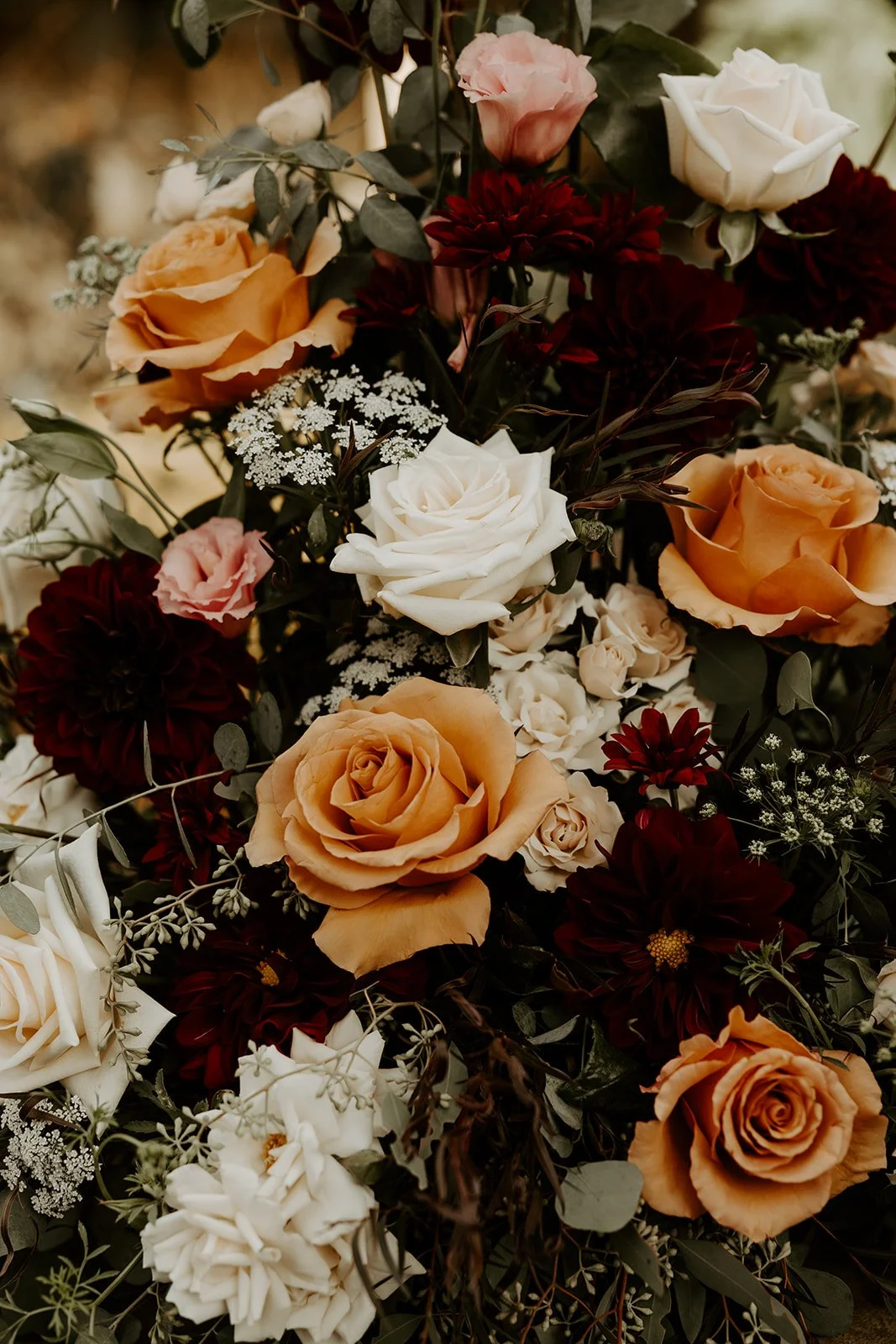 Fall wedding flowers in orange and burgundy