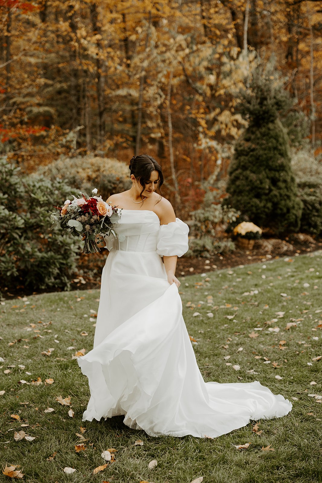 A bride spinning in her fall wedding dress