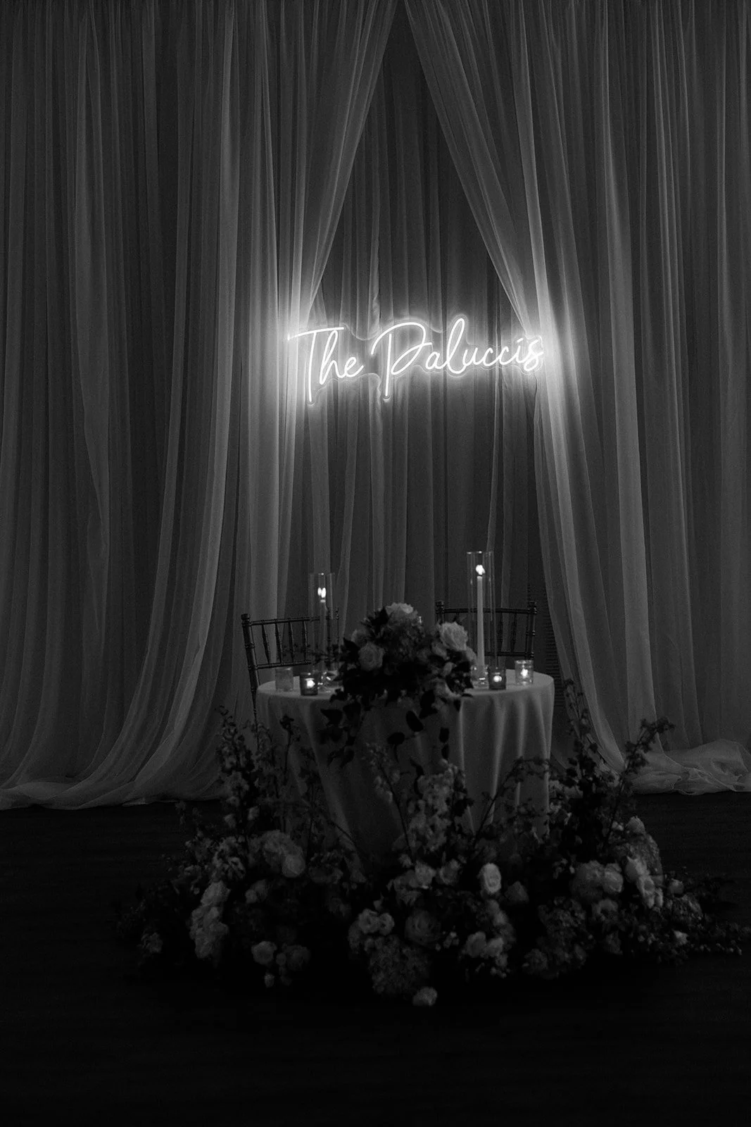 A sweetheart table with a neon sign at a Waverly Oaks wedding