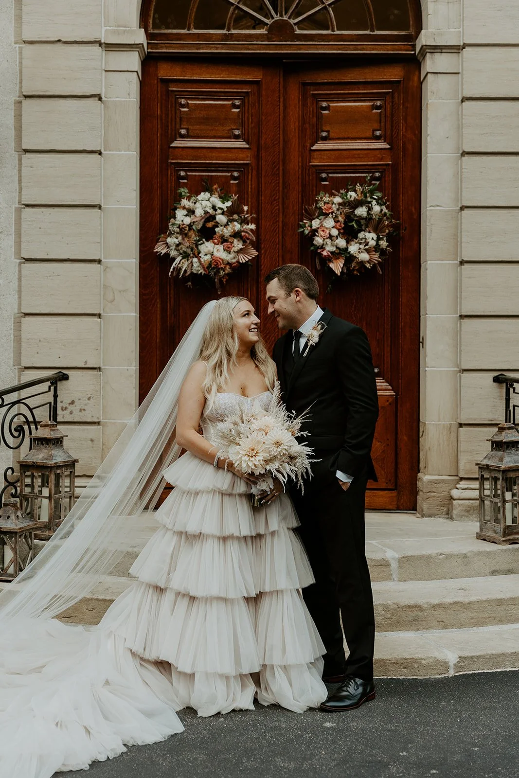 A bride and groom posing for wedding photos at their Rhode Island wedding venue Glen Manor