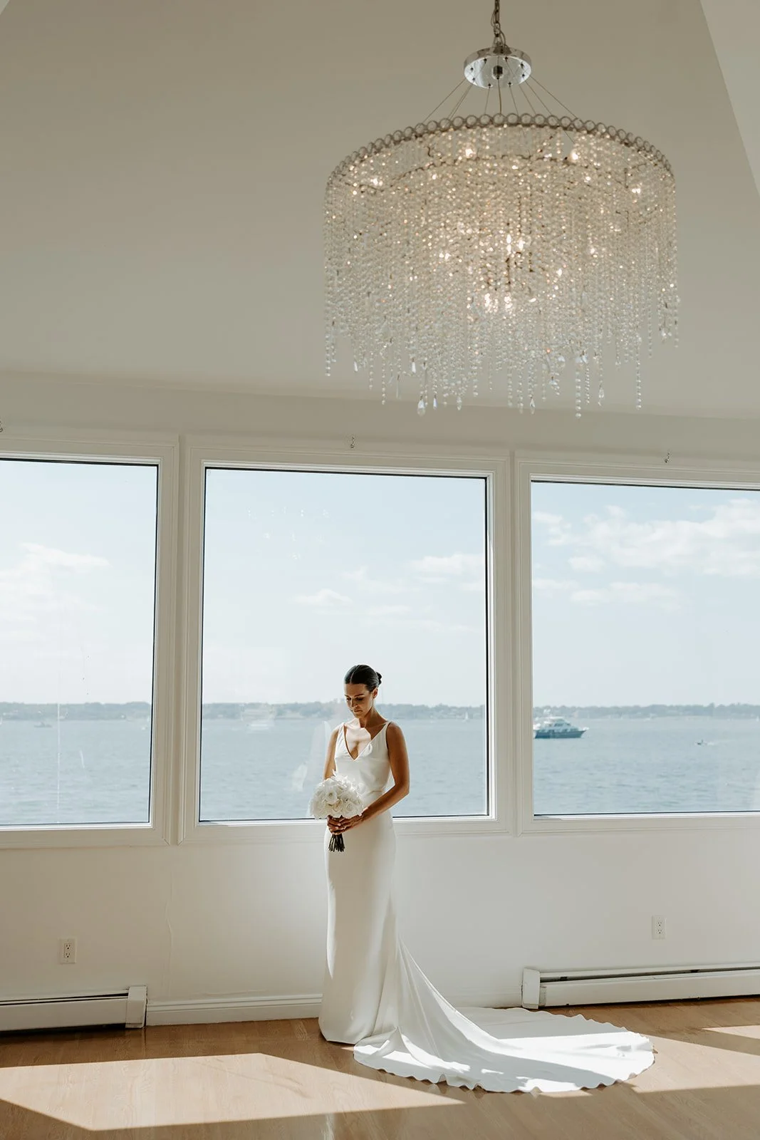 A bride posing for portraits in the bridal suite at Rhode Island wedding venue Belle Mer