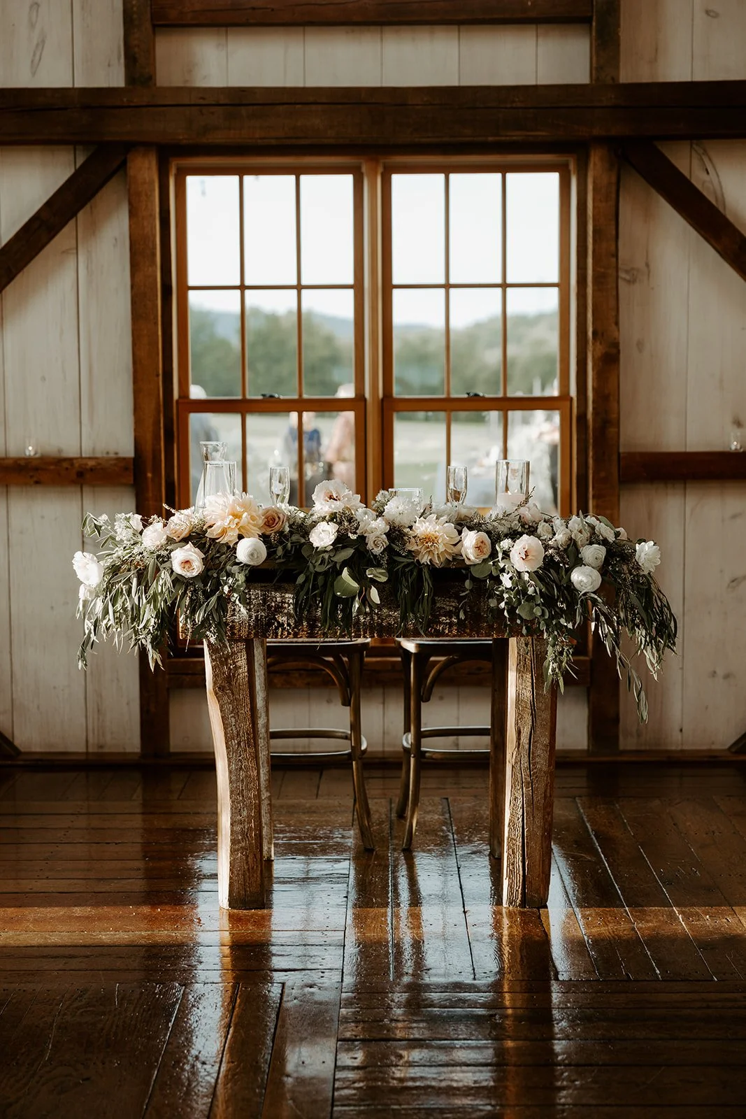 A sweetheart table from a barn wedding reception