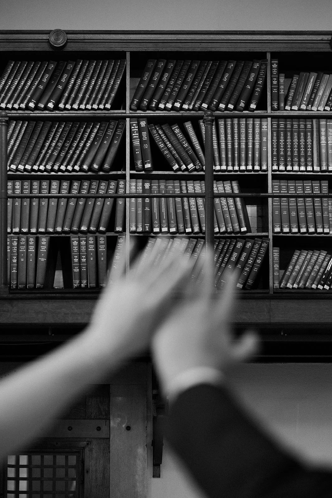 a bride and groom showing off their rings at their Boston Public Library Wedding