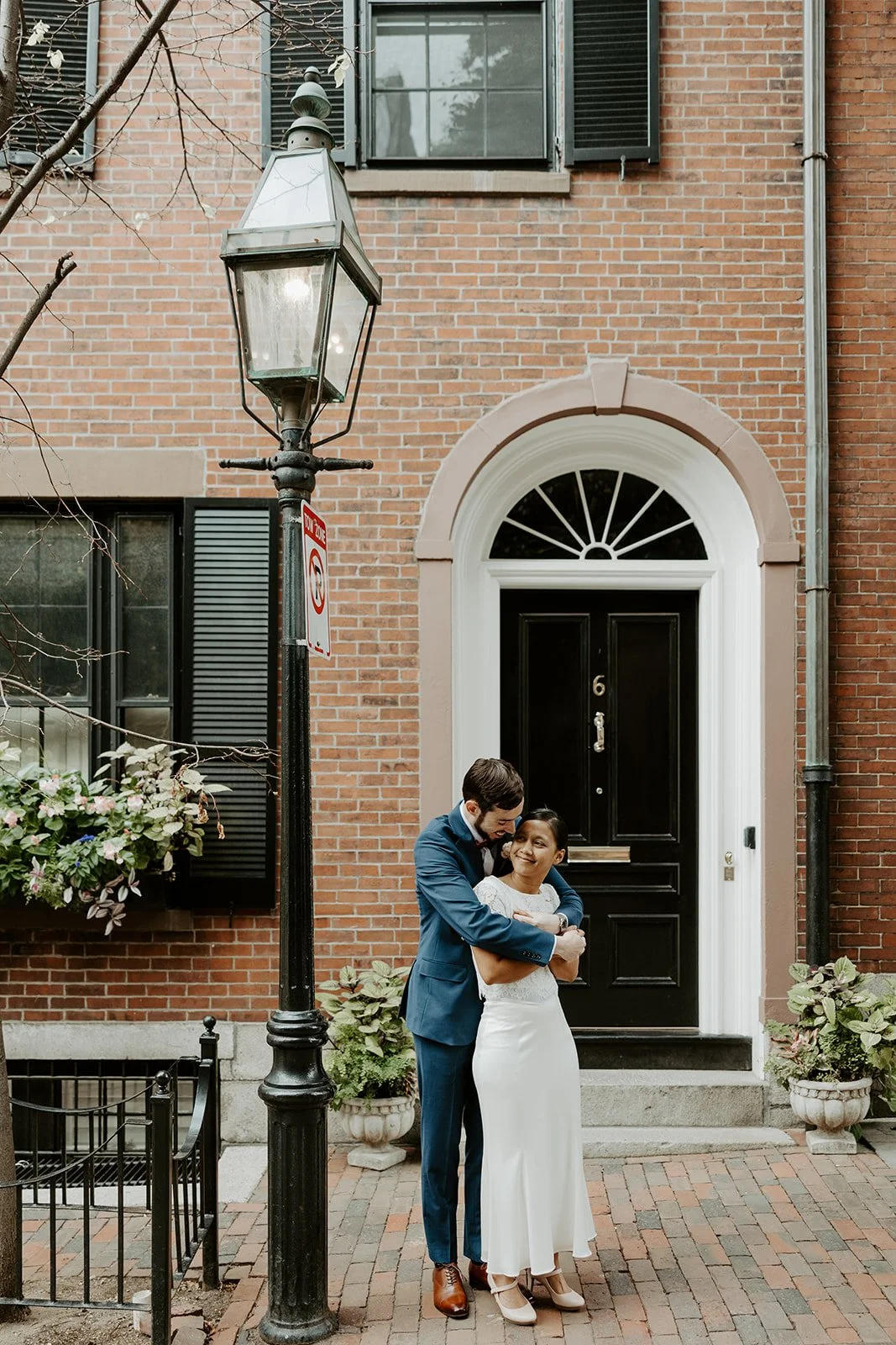 An elopement couple posing for portraits in Beacon Hill