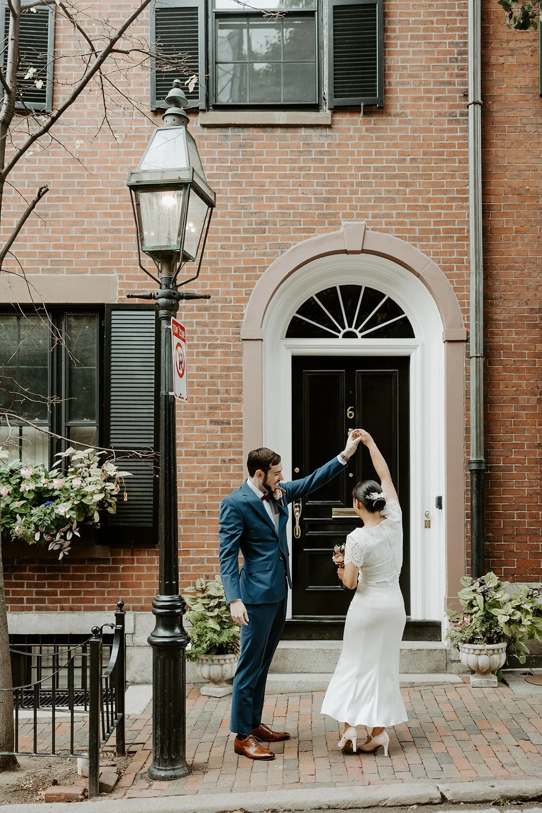 An elopement couple posing for portraits in Beacon Hill