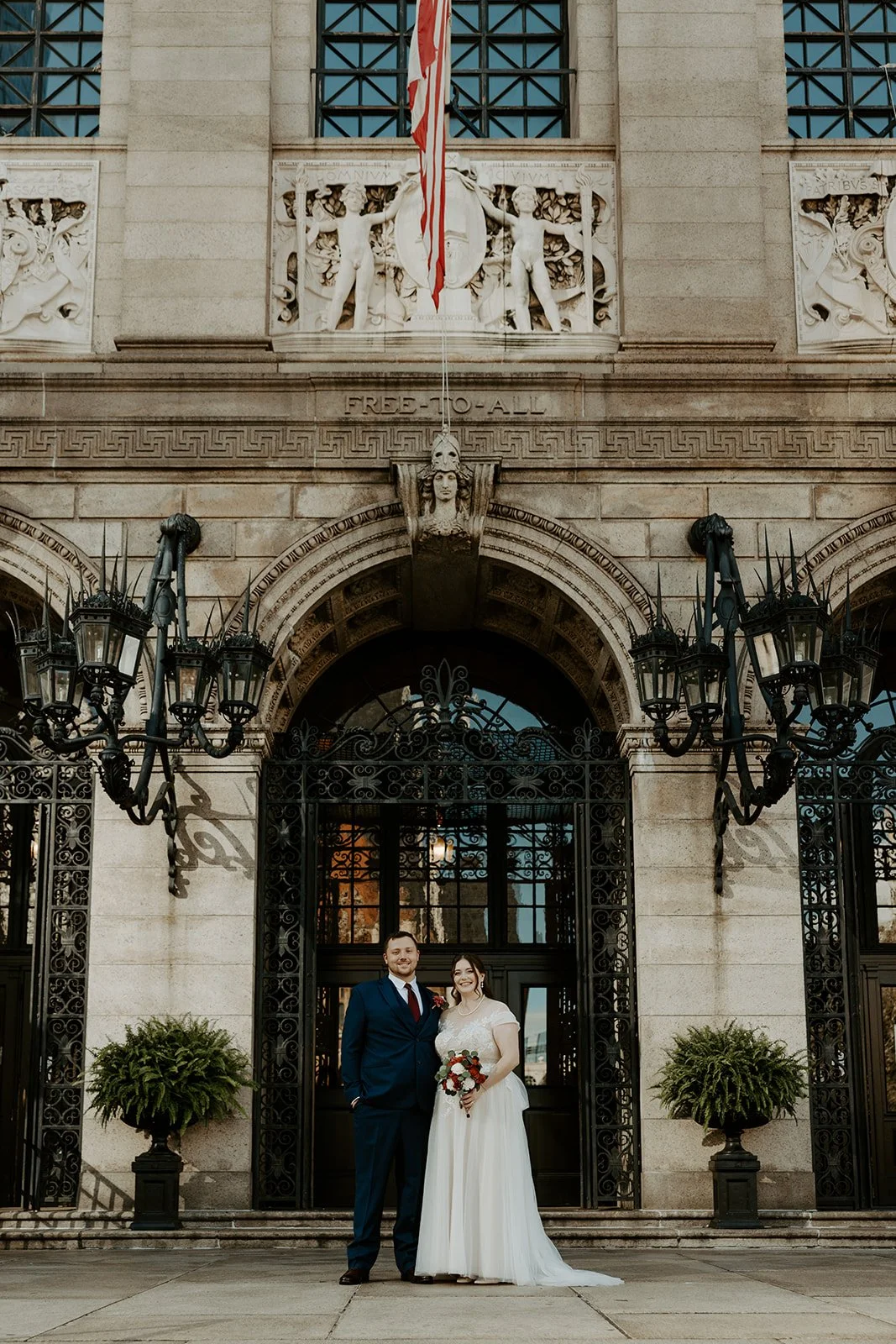 A bride and groom outside of the Library after their Boston Public Library wedding
