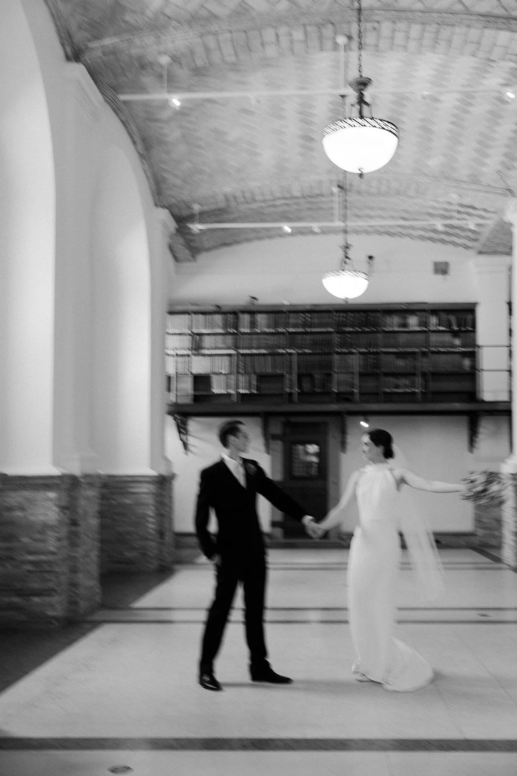 A bride and groom dancing at their Boston Public Library elopement