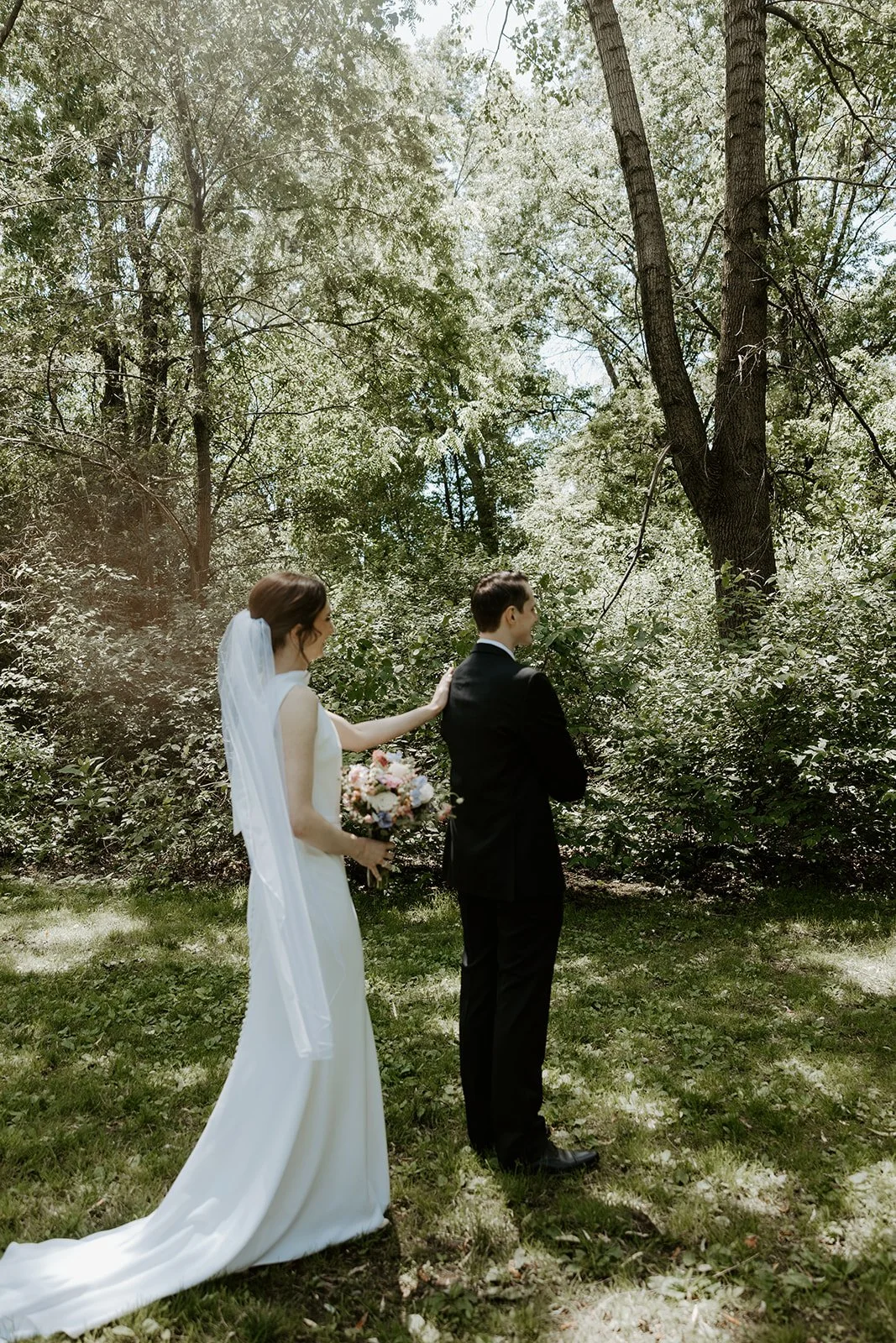 A bride and groom doing a wedding first look in Boston Public Garden