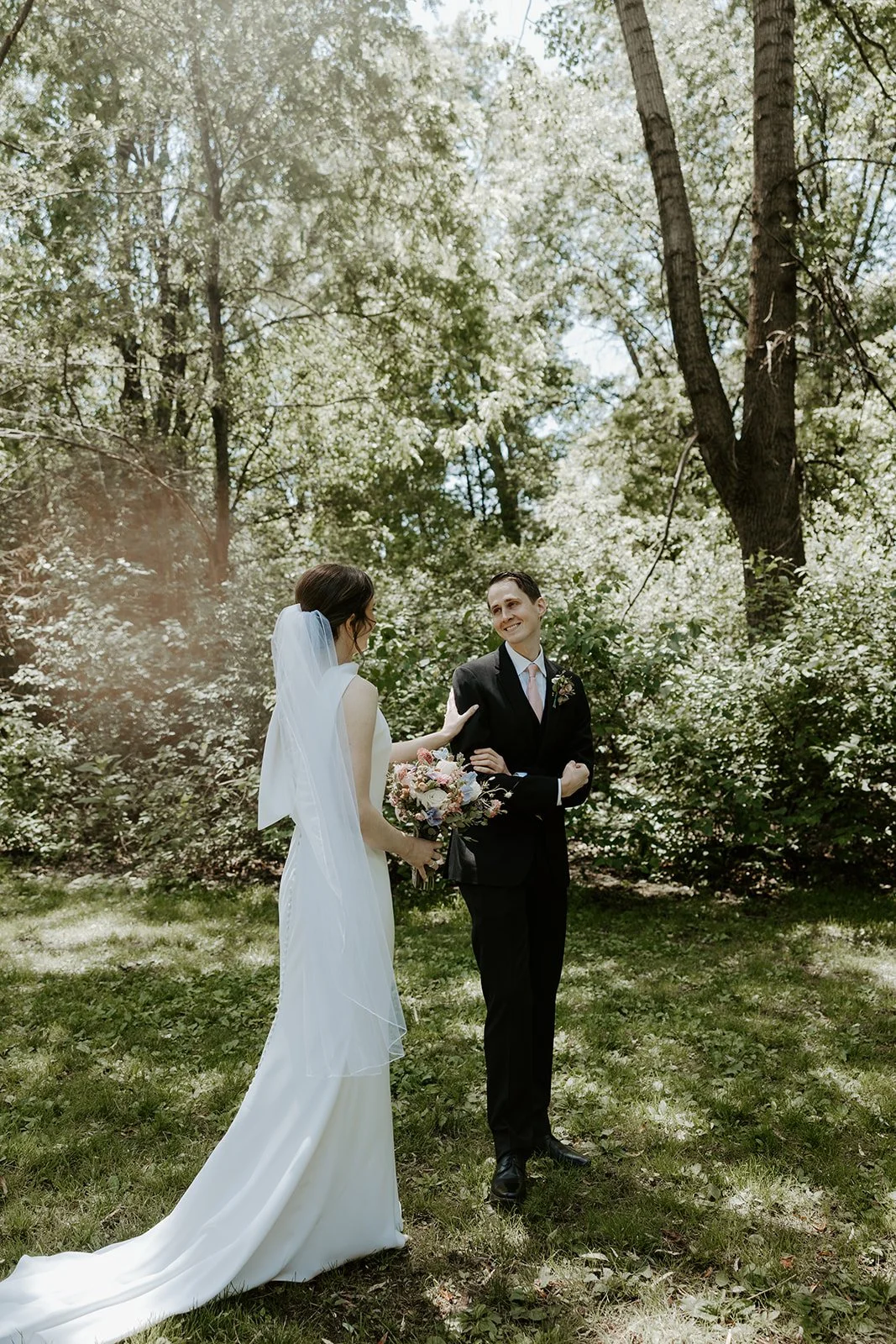 A bride and groom doing a wedding first look in Boston Public Garden