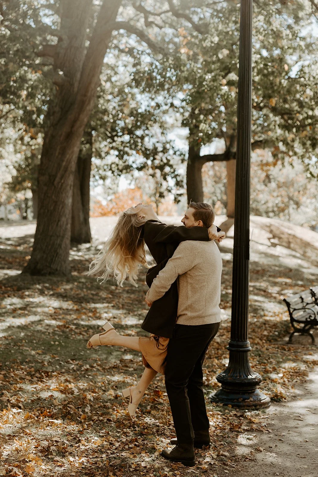 A couple posing for engagement photos at Jamaica Pond, one of my favorite Massachusetts engagement photo locations