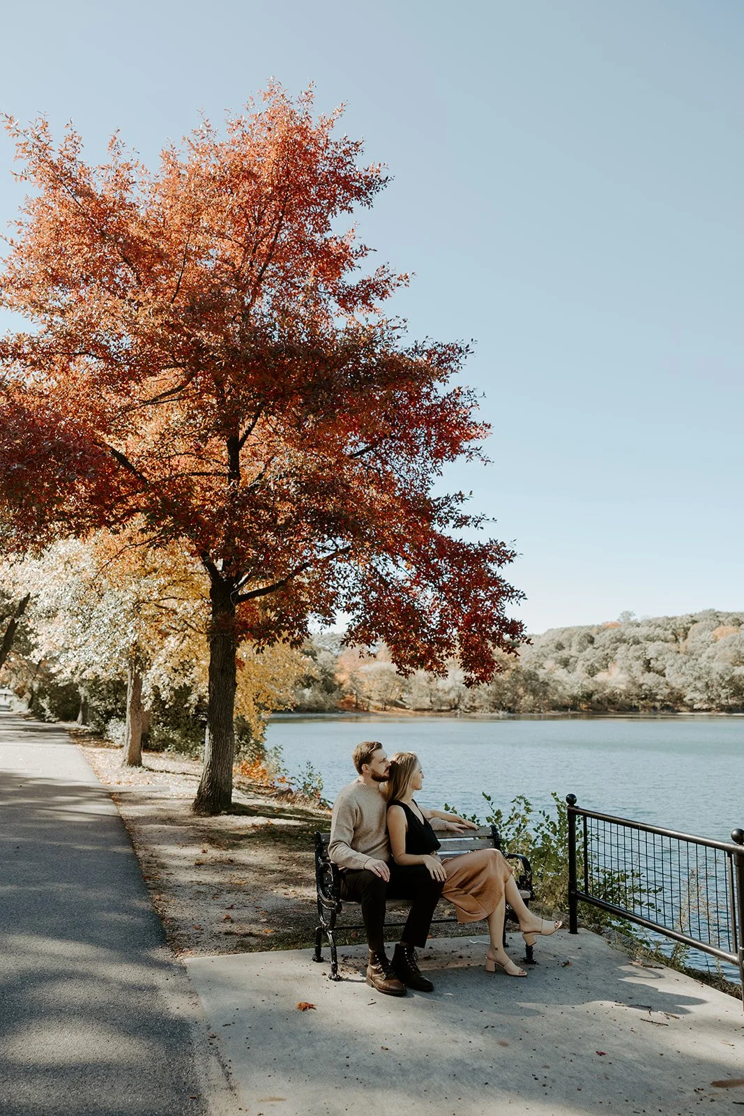A couple posing for engagement photos at Jamaica Pond, one of my favorite Massachusetts engagement photo locations